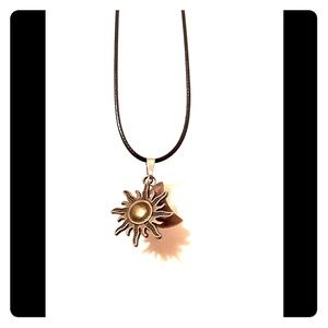 Sun with purple moon pendant on 18in black cord